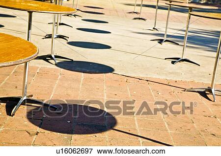 Outdoor tables with no chairs View Large Photo Image Stock Photo - Outdoor tables with no chairs. Fotosearch