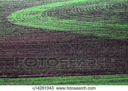 Stock Image - Ploughed field patterns . Fotosearch