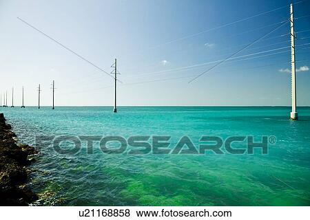 Power lines in the water View Large Photo Image Stock Photo - Power lines in the water. Fotosearch