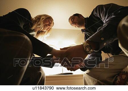 Stock Image - Praying couple. Fotosearch