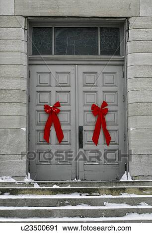 Red bows on doors of a grey building, Waterloo, Quebec View Large Photo Image Stock Image - Red bows on doors of a grey building, Waterloo, Quebec. Fotosearch