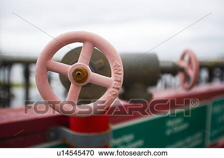 Stock Image - Red valve handles . Fotosearch