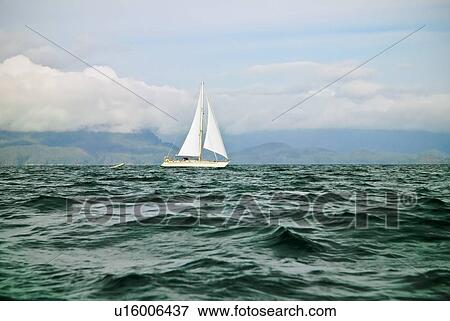 Stock Photo - Sailboat on water. Fotosearch