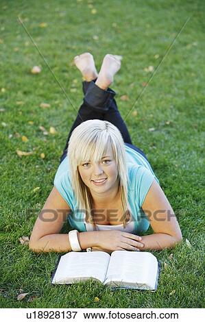 Teenager with book View Large Photo Image Stock Photo - Teenager with book. Fotosearch