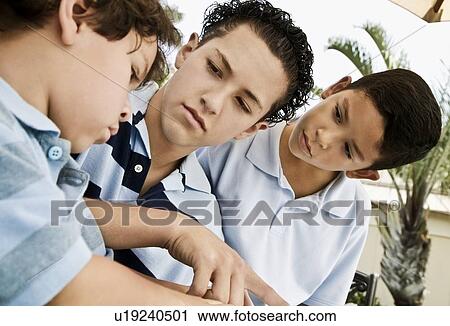Three boys working together View Large Photo Image Stock Image - Three boys working together. Fotosearch