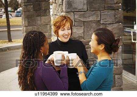 Stock Photo - Three women visiting together. Fotosearch