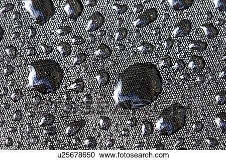 Stock Image - Water drops on fabric. Fotosearch