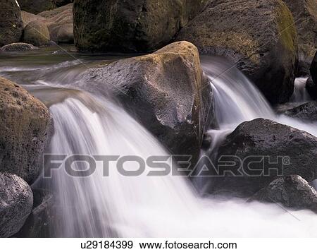 Water flowing over rocks, Napali Coast State Park, Kauai, Hawaii View Large Photo Image Stock Photo - Water flowing over rocks, Napali Coast State Park, Kauai, Hawaii. Fotosearch
