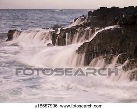 Waterfalls flowing into the ocean, Kauai, Hawaii View Large Photo Image Stock Photograph - Waterfalls flowing into the ocean, Kauai, Hawaii. Fotosearch