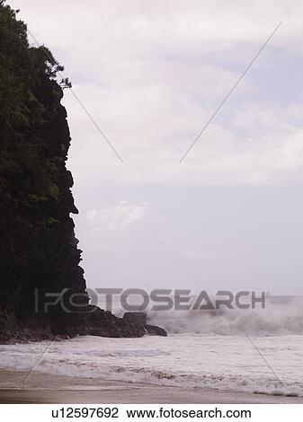 Waves against a cliff, Napali Coast State Park, Kauai, Hawaii View Large Photo Image Stock Image - Waves against a cliff, Napali Coast State Park, Kauai, Hawaii. Fotosearch