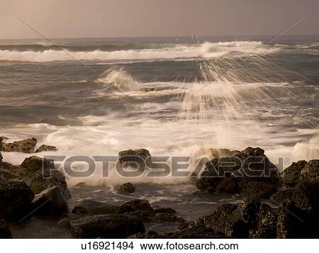 Picture - Waves crashing against the rocks, Poipu, Kauai, Hawaii. Fotosearch