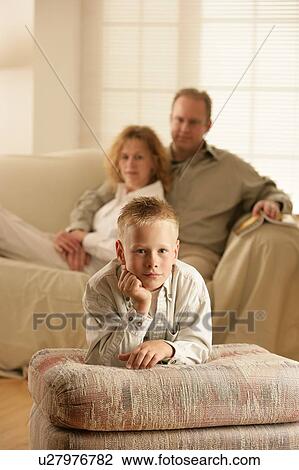 A boy and his parents View Large Photo Image Stock Image - A boy and his parents. Fotosearch