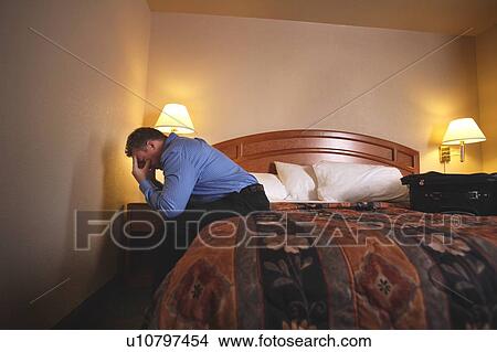 A businessman in hotel room View Large Photo Image Picture - A businessman in hotel room. Fotosearch