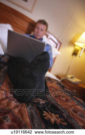 A businessman using a laptop View Large Photo Image Stock Image - A businessman using a laptop. Fotosearch