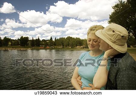 A couple by a lake View Large Photo Image Stock Image - A couple by a lake. Fotosearch