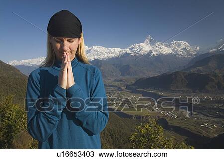 A woman in prayer View Large Photo Image Stock Image - A woman in prayer. Fotosearch