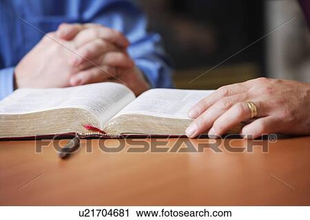 Bible and praying hands View Large Photo Image Stock Image - Bible and praying hands. Fotosearch