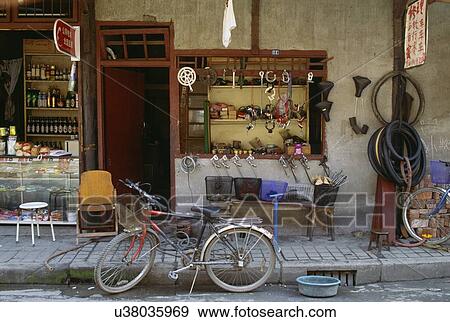 Stock Photo - Bicycle in front of bicycle repair shop. Fotosearch