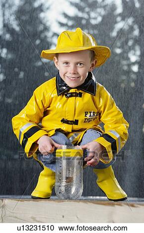 Boy in the rain View Large Photo Image Stock Image - Boy in the rain. Fotosearch
