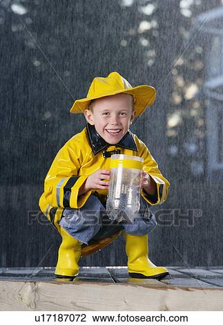 Boy in the rain View Large Photo Image Stock Image - Boy in the rain. Fotosearch