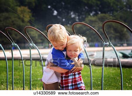 Stock Photo - Brother and sister hugging. Fotosearch
