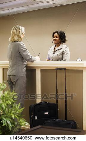 Businesswoman going out of town View Large Photo Image Stock Image - Businesswoman going out of town. Fotosearch