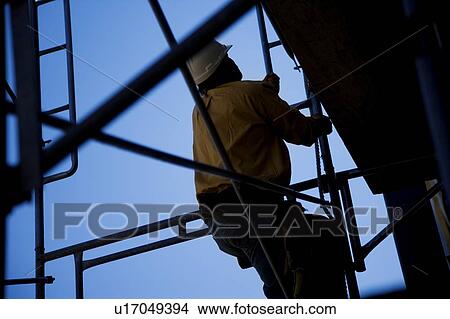 Construction worker climbing View Large Photo Image Picture - Construction worker climbing. Fotosearch