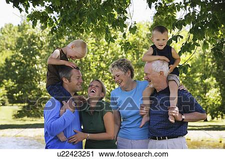 Family having fun together View Large Photo Image Stock Image - Family having fun together. Fotosearch