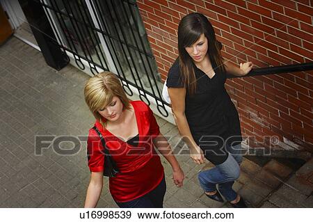 Friends climbing the stairs View Large Photo Image Stock Photo - Friends climbing the stairs. Fotosearch