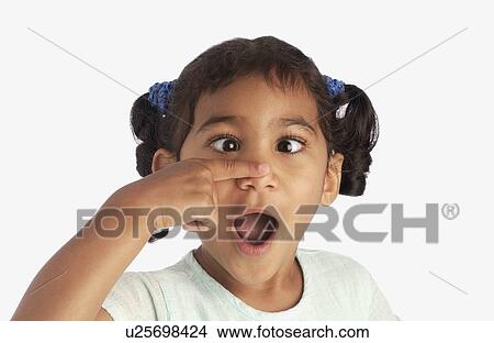 Girl crossing her eyes and touching her nose View Large Photo Image Picture - Girl crossing her eyes and touching her nose. Fotosearch
