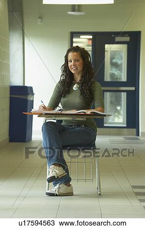 Girl in school desk View Large Photo Image Stock Image - Girl in school desk. Fotosearch