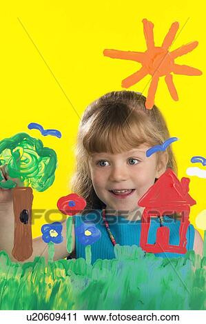 Stock Image - Girl painting on glass. Fotosearch