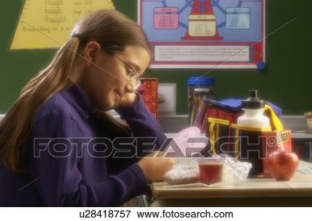 Girl reading note View Large Photo Image Stock Photo - Girl reading note. Fotosearch