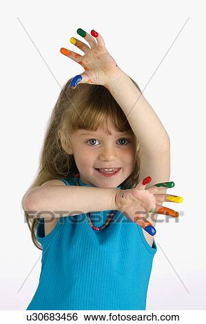Stock Photograph - Girl with paint on her fingers. Fotosearch