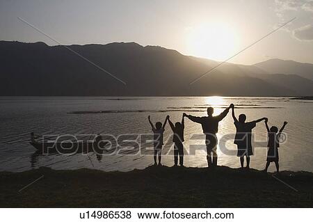 Group of people with arms raised to heaven View Large Photo Image Stock Photo - Group of people with arms raised to heaven. Fotosearch