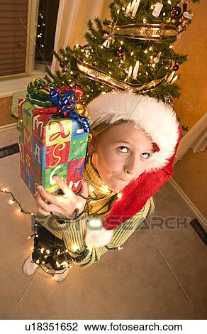 Stock Image - Guessing what's inside present. Fotosearch