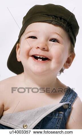 Head and shoulders portrait of a boy laughing View Large Photo Image Stock Photo - Head and shoulders portrait of a boy laughing. Fotosearch