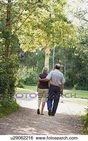 Husband and wife on walking trail View Large Photo Image Stock Photograph - Husband and wife on walking trail. Fotosearch