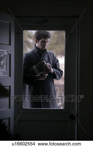 Picture - Man holding a wooden box. Fotosearch