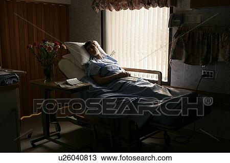 Man in a hospital bed View Large Photo Image Stock Image - Man in a hospital bed. Fotosearch