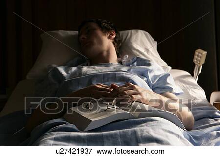 Man in a hospital bed View Large Photo Image Stock Photo - Man in a hospital bed. Fotosearch