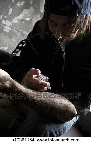 Man injecting drugs View Large Photo Image Picture - Man injecting drugs. Fotosearch