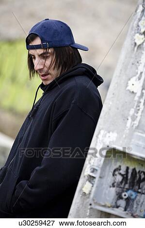 Man looking down View Large Photo Image Stock Photo - Man looking down. Fotosearch
