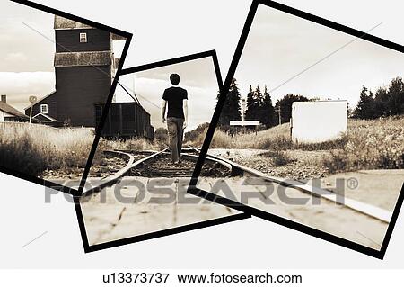 Man on railway tracks View Large Photo Image Stock Photo - Man on railway tracks. Fotosearch