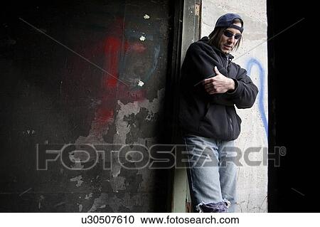 Man wearing warn out clothing View Large Photo Image Stock Image - Man wearing warn out clothing. Fotosearch