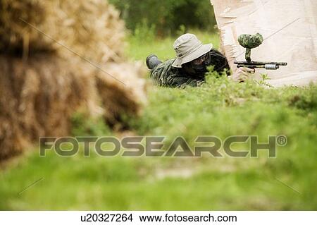 Person with paintball gun View Large Photo Image Picture - Person with paintball gun. Fotosearch