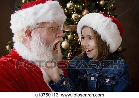 Santa Claus with a girl View Large Photo Image Stock Image - Santa Claus with a girl. Fotosearch