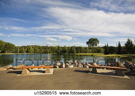Seating area on the edge of a lake View Large Photo Image Stock Photography - Seating area on the edge of a lake. Fotosearch