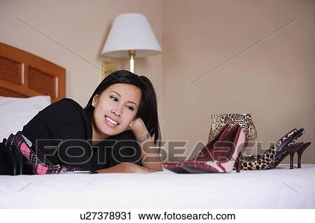 Stock Image - Woman enjoying her shoes. Fotosearch