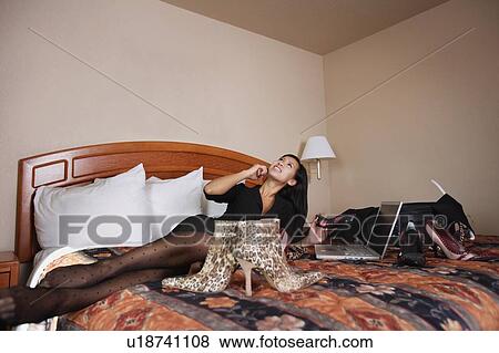 Woman on phone surrounded by shoes View Large Photo Image Stock Photo - Woman on phone surrounded by shoes. Fotosearch